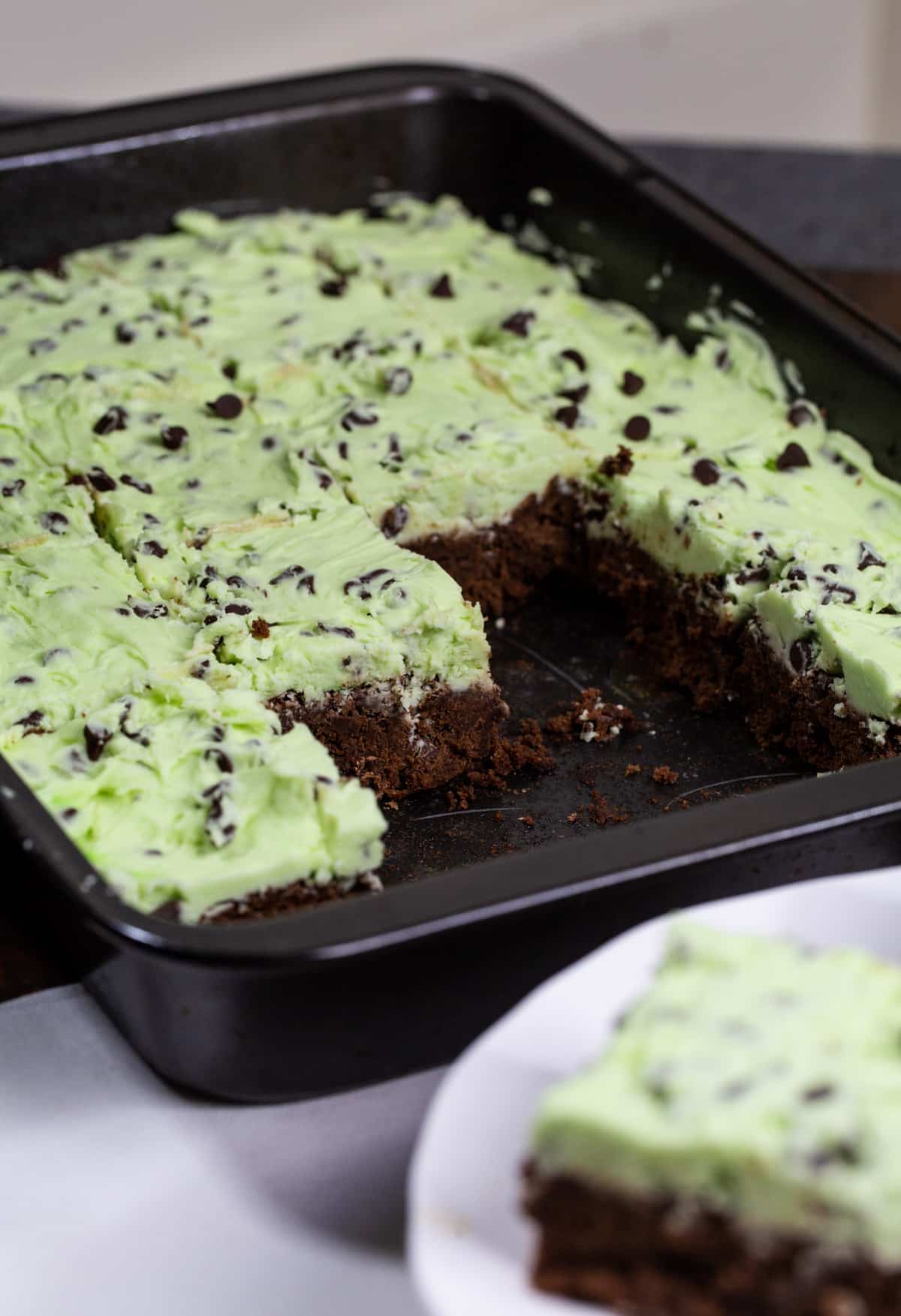 Brownies with Creme de Menthe-Chocolate Chip Frosting in baking dish.