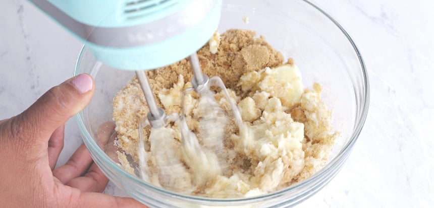 Mixing butter with sugar.