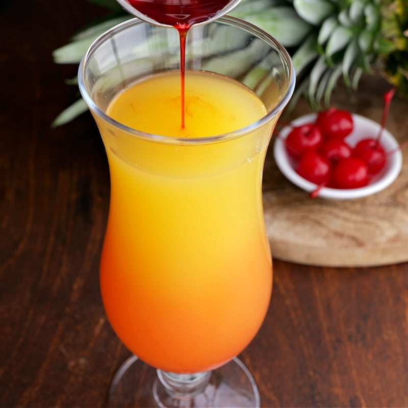 Grenadine being poured into glass.