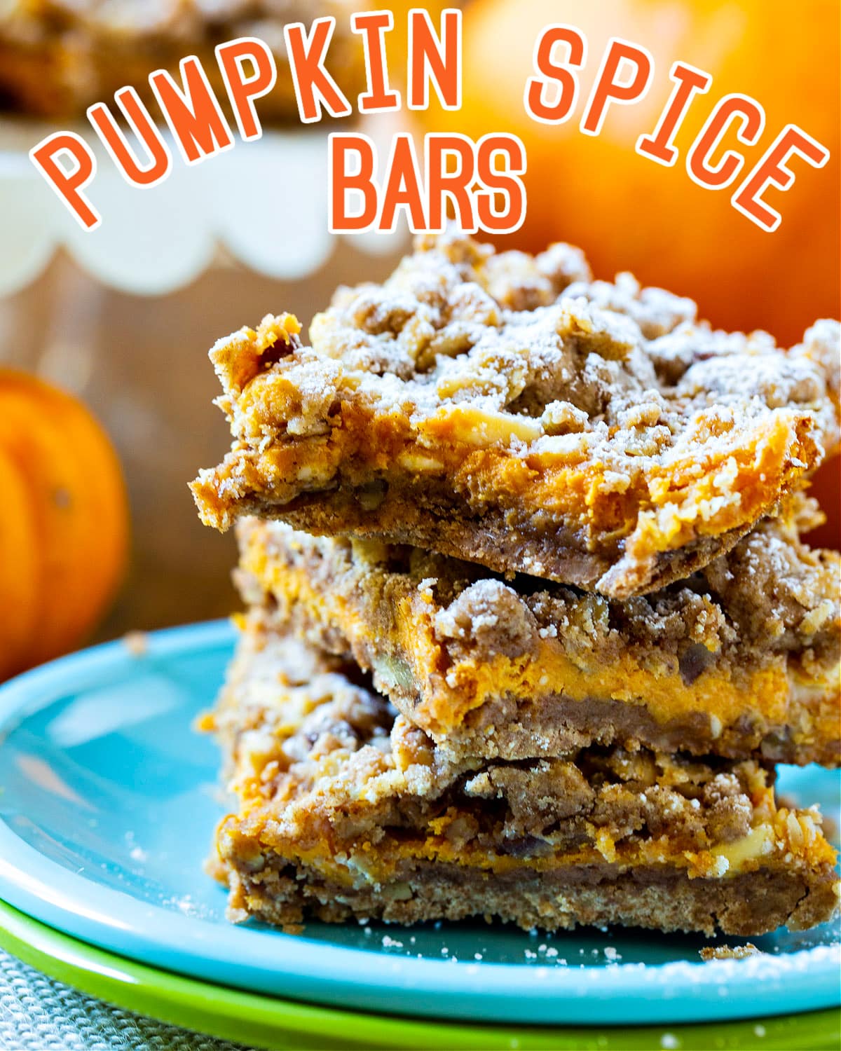 Pumpkin Spice Bars stacked on top of each other.