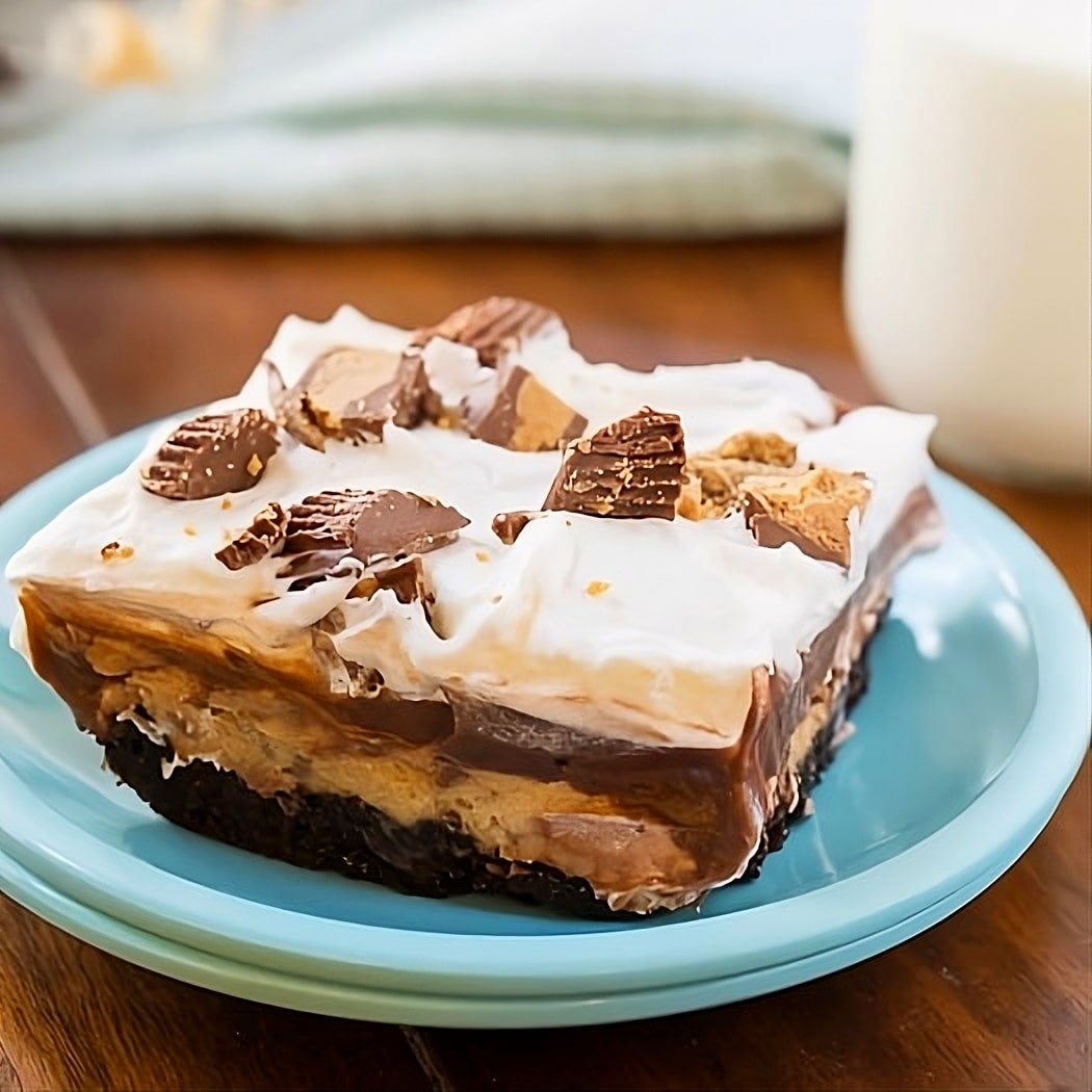 Piece of Chocolate Peanut Butter Layer Dessert on a plate.