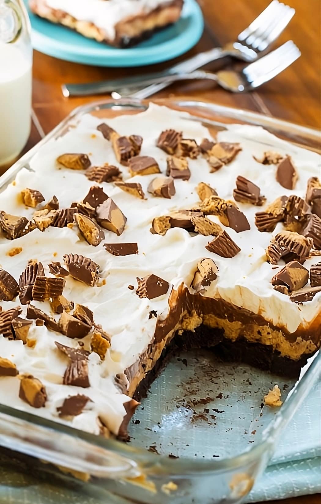 Chocolate Peanut Butter Lush in baking pan with a piece removed.