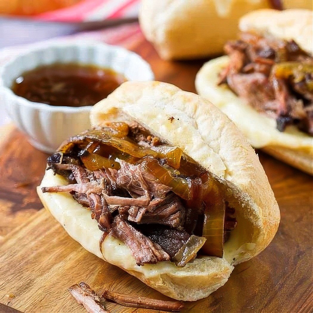 Crockpot French Dip Sandwich on a wooden board.