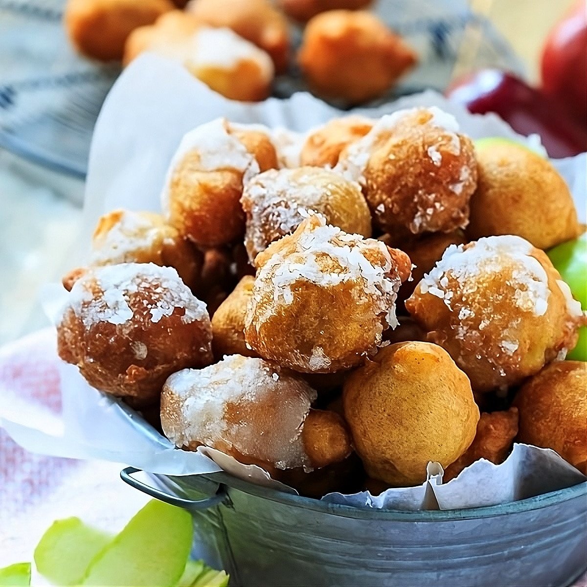 Apple Fritters in a metal container.