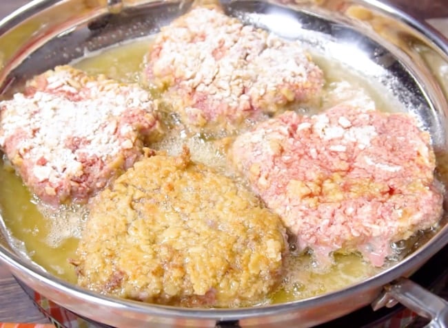 Cooking the cubed steak.