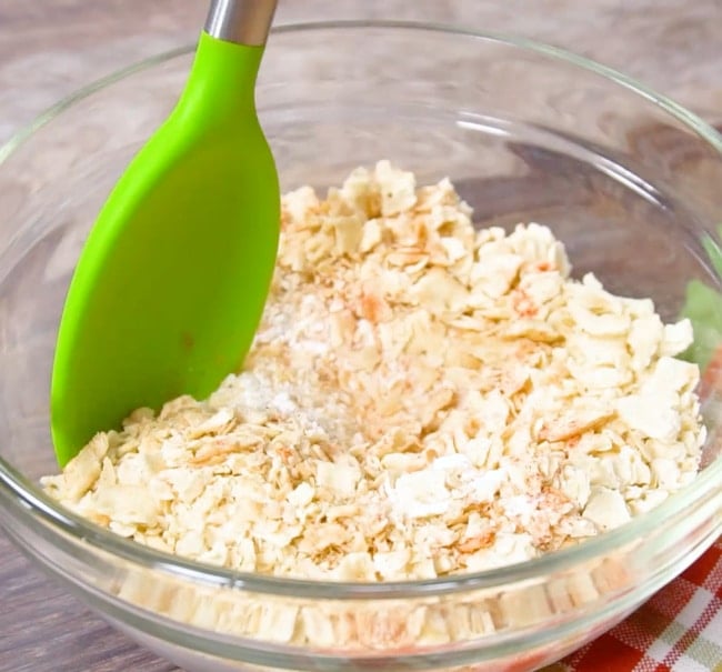 Mixing saltine cracker mixture.