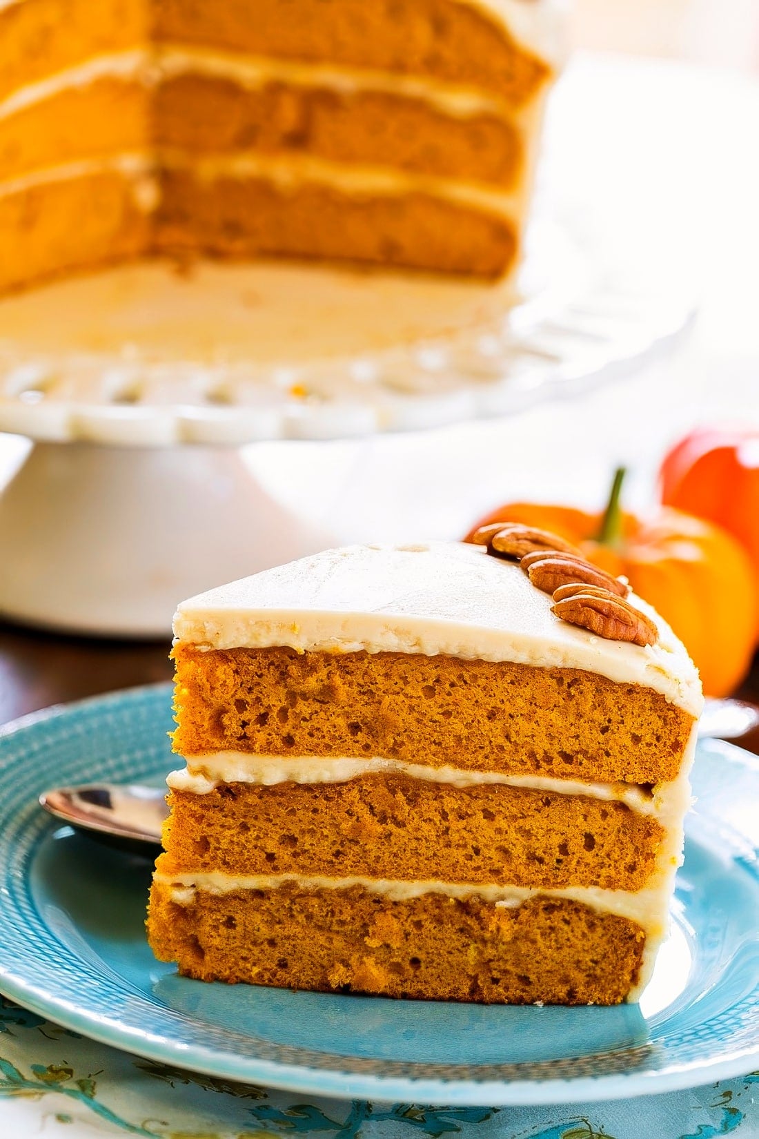 Slice of Butterscotch Pumpkin Cake on a blue plate.