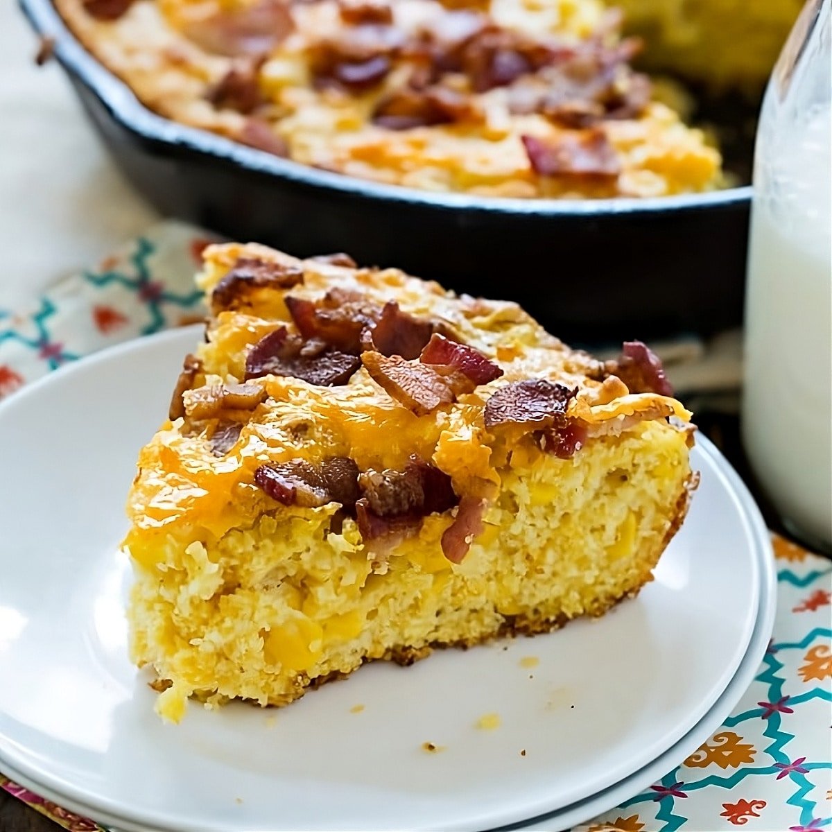 Piece of Bacon Cheddar Cornbread on a small plate.