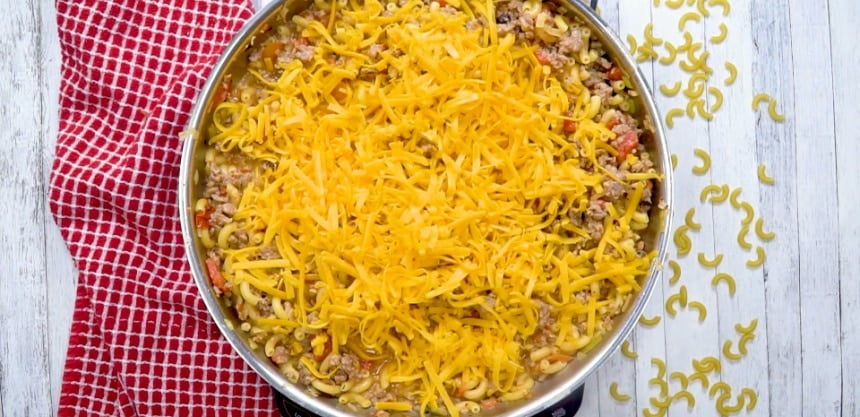 Cheese added to the pan.