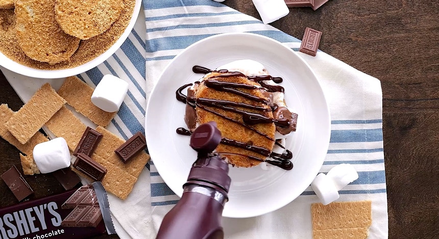 Drizzling with fudge sauce.