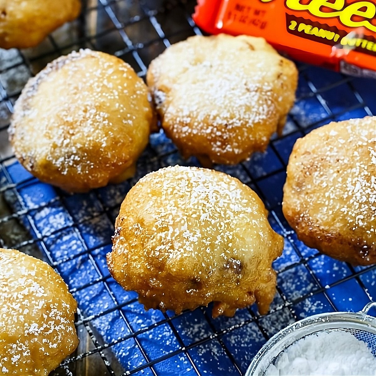 Deep-Fried Peanut Butter Cups on a wire rack.