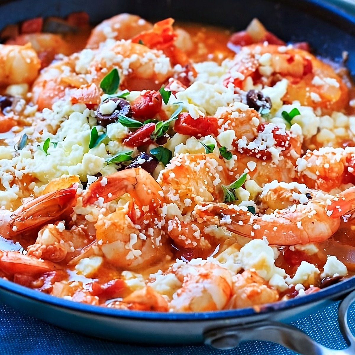 Greek Shrimp with Tomatoes and Feta in a skillet.