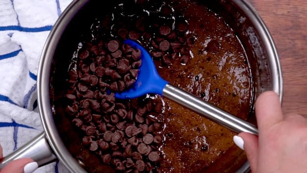 Mixing in chocolate chips.