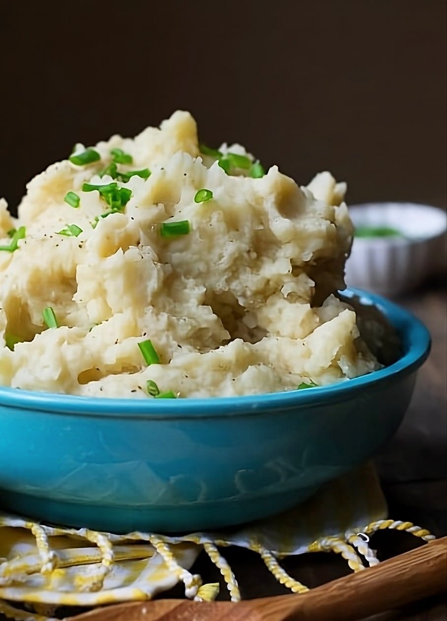 Crock Pot Mashed Potatoes in a blue serving bowl.