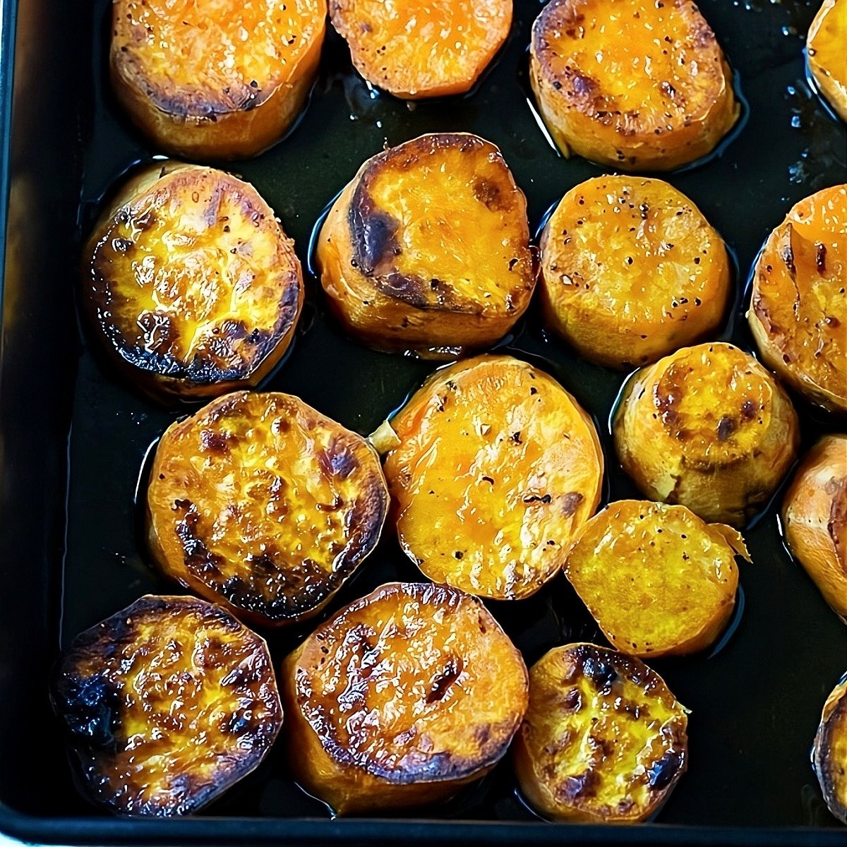 Melting Sweet Potatoes in a baking pan.