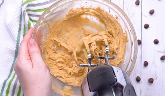 Mixing peanut butter mixture.