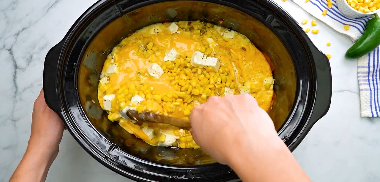 Stirring the ingredients halfway through cooking time.