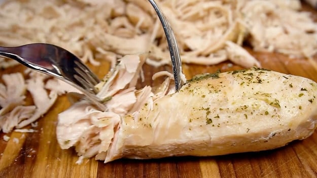 Shredding the chicken.