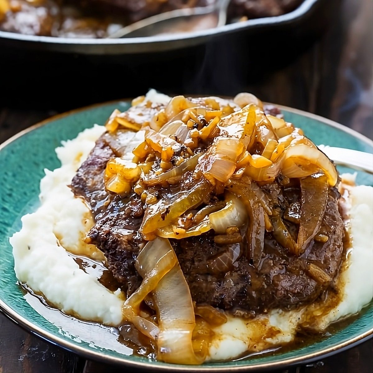 Cubed steak served over mashed potatoes.