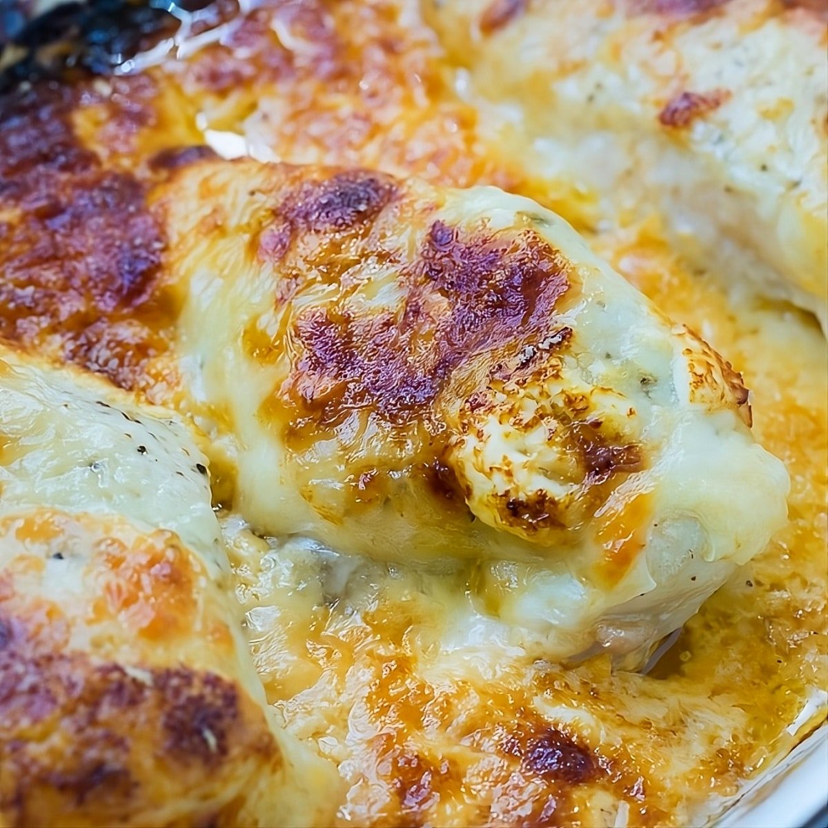 Creamy Baked Swiss Chicken in baking dish.