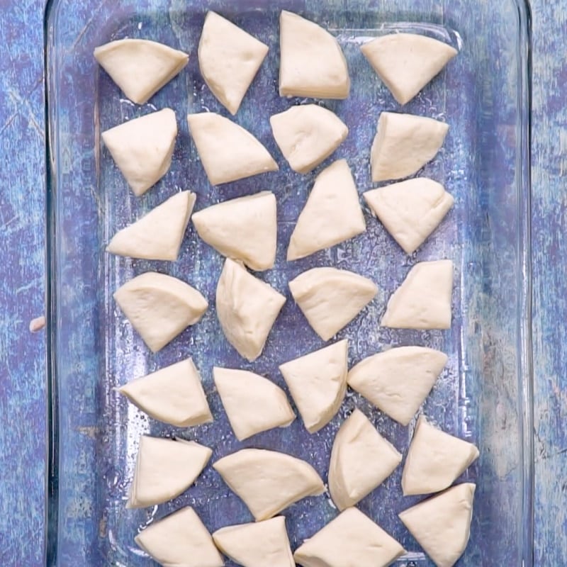 Biscuit pieces in baking dish.