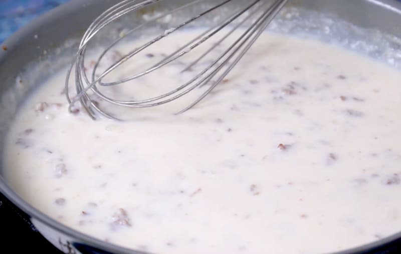 Sausage gravy mixture in pan.