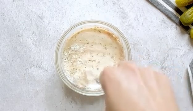 Mixing the sauce.