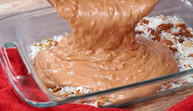 Pouring batter into pan.