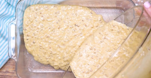 Batter being poured into cake.