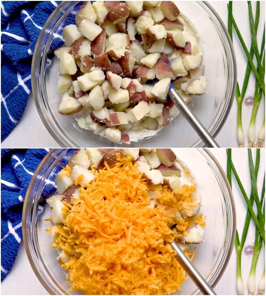 Potato salad being mixed in mixing bowl.