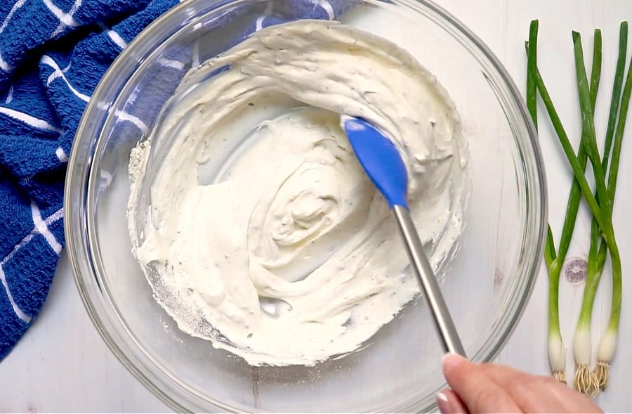 Potato salad dressing being mixed.
