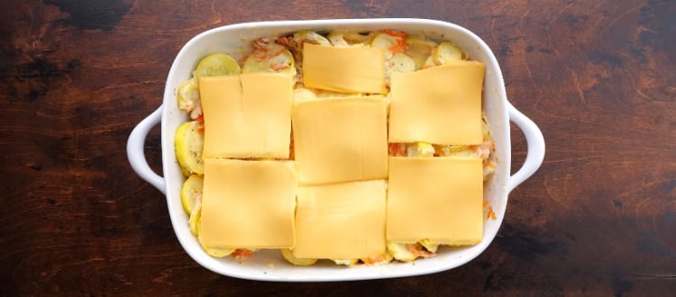 Cheese slices arranged on top.