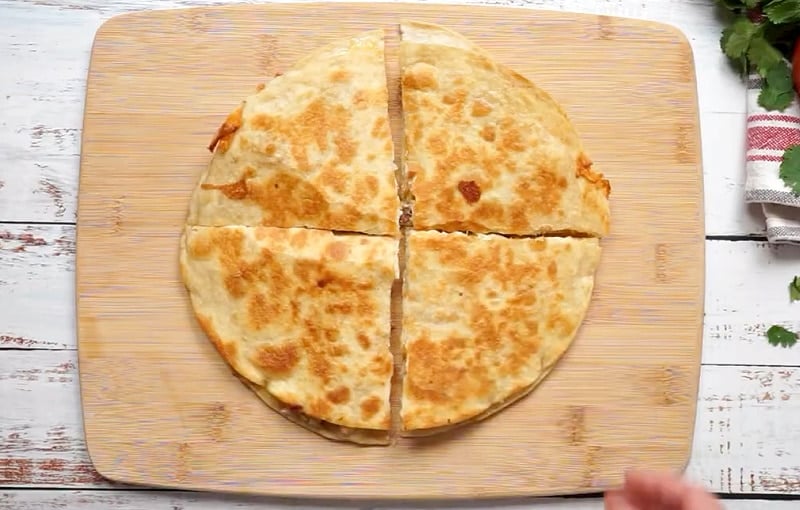 Quesadilla cut into fourths.