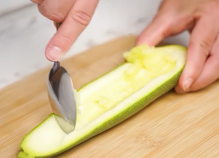 Removing seeds from zucchini.