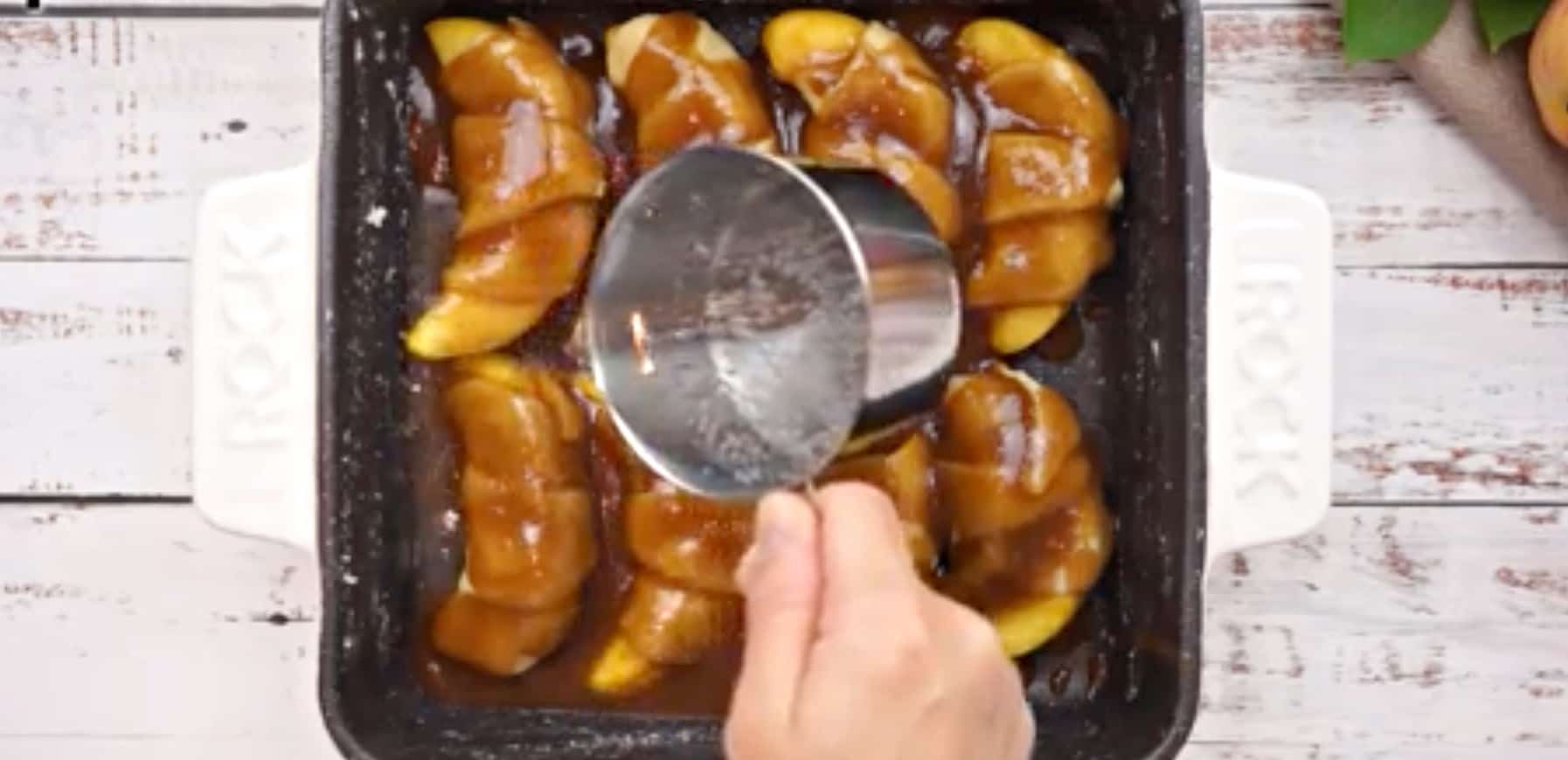 Pouring Sprite into baking dish.