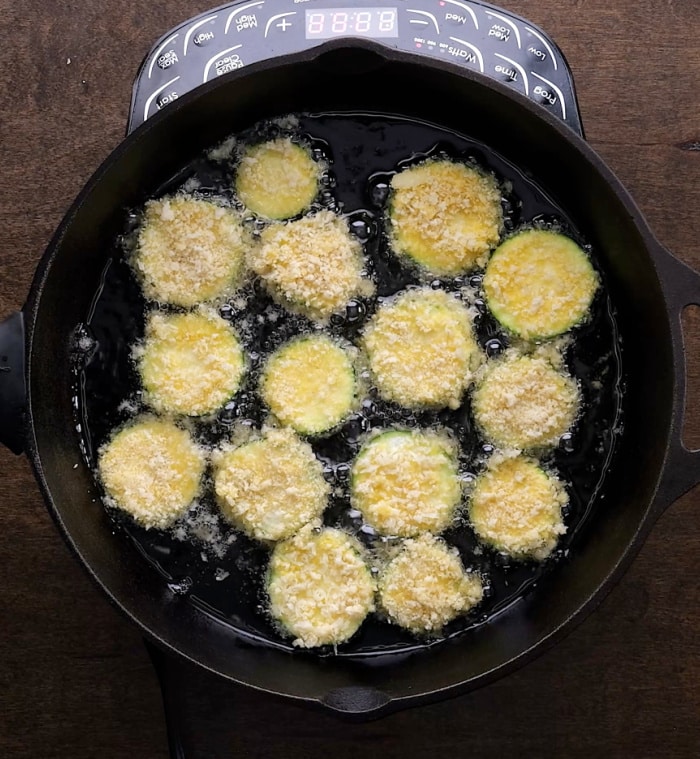 Frying the zucchini.