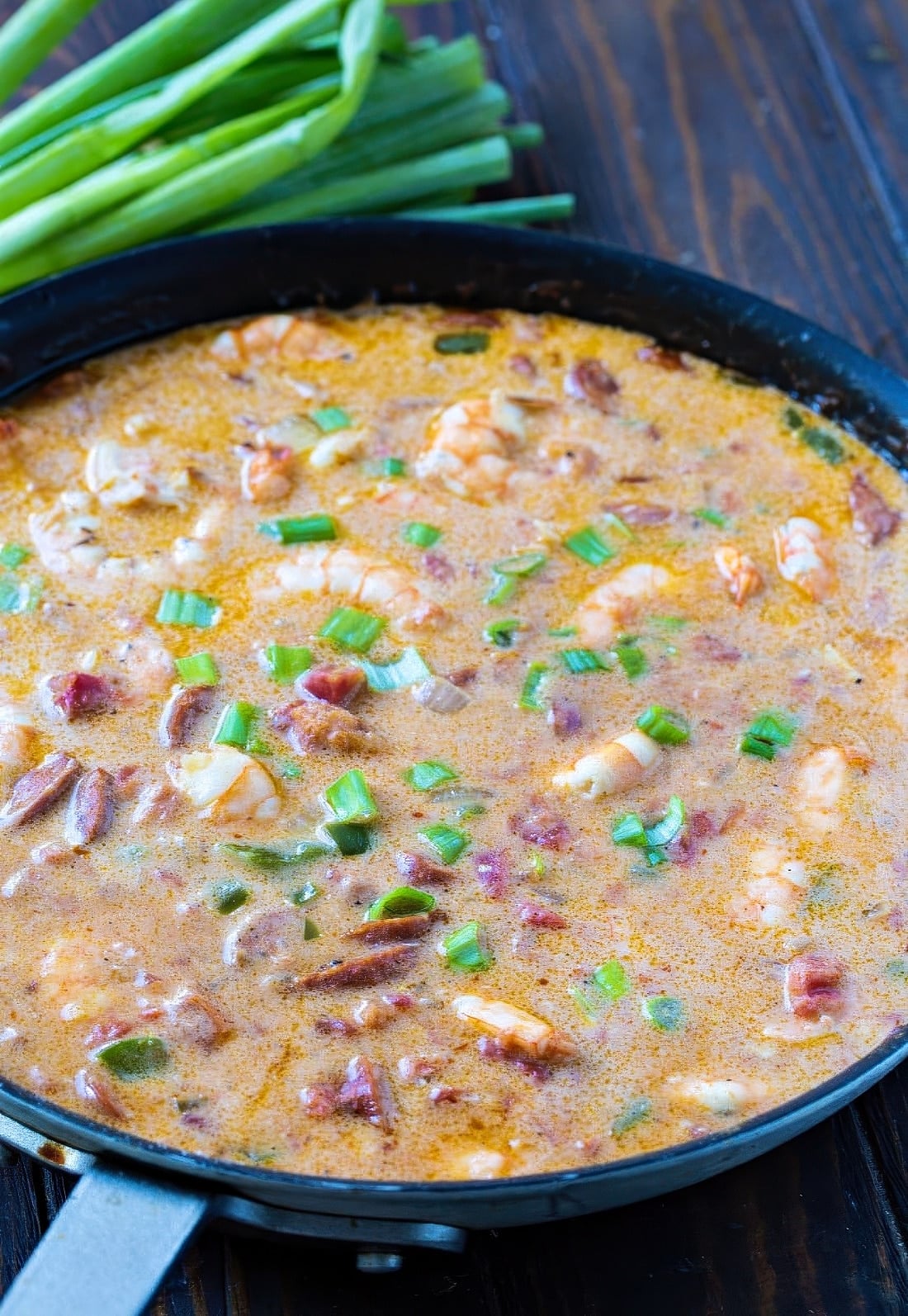Smothered shrimp sauce in a skillet.