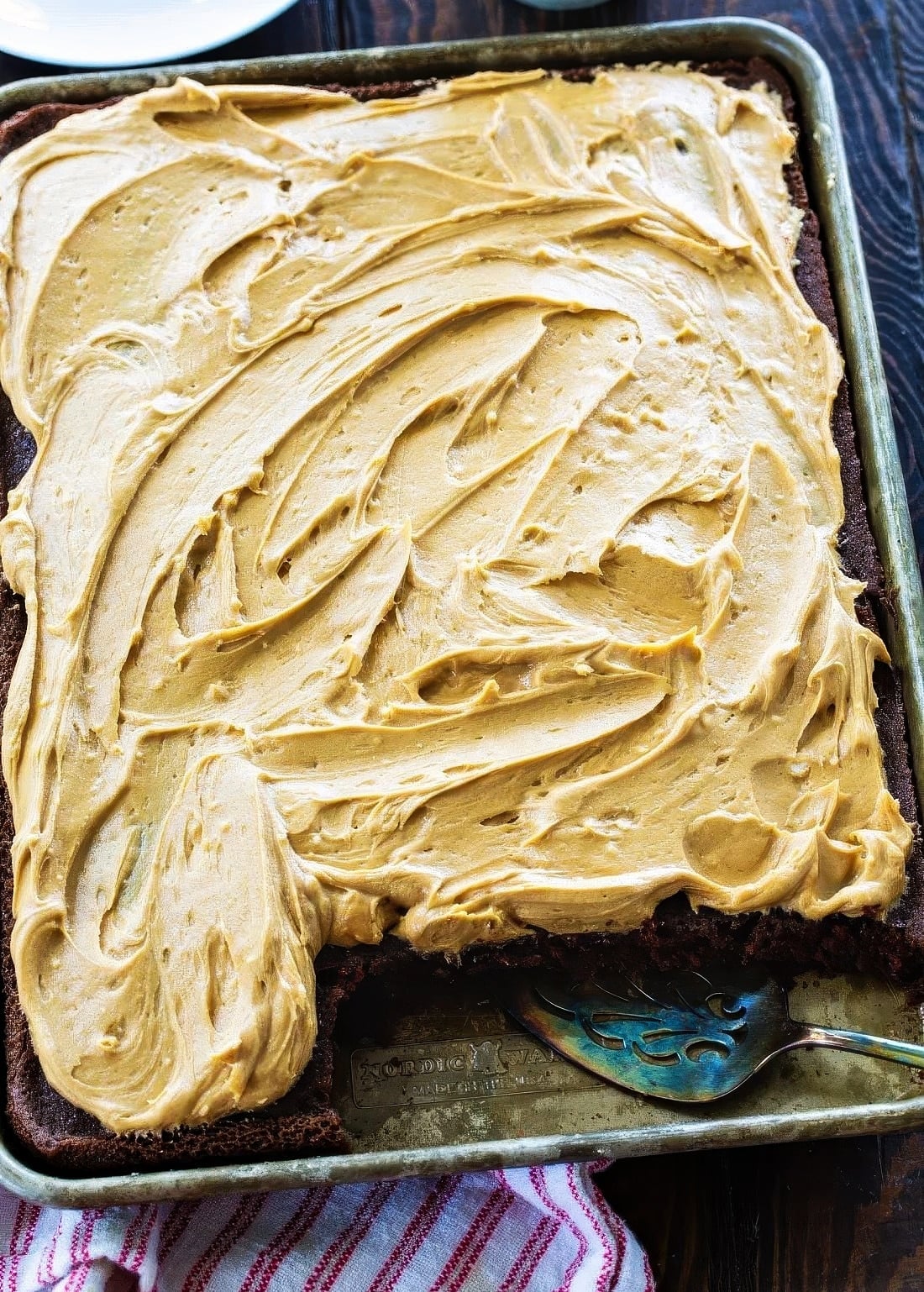 Texas Sheet Cake with Peanut Butter Frosting in a sheet pan.