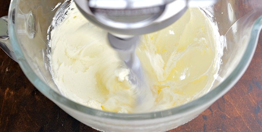 Mixing the butter and cream cheese.