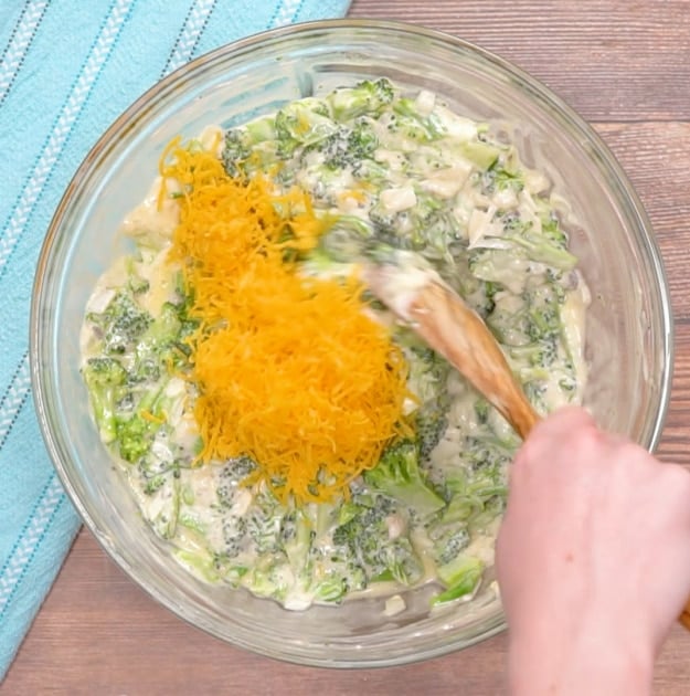 Mixing in the cheese.