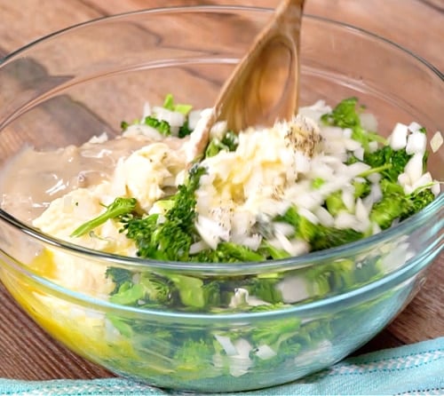 Mixing broccoli mixture together.