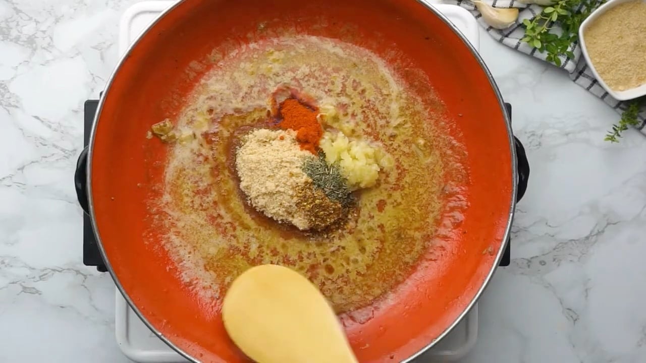 Making pork chop glaze in skillet.