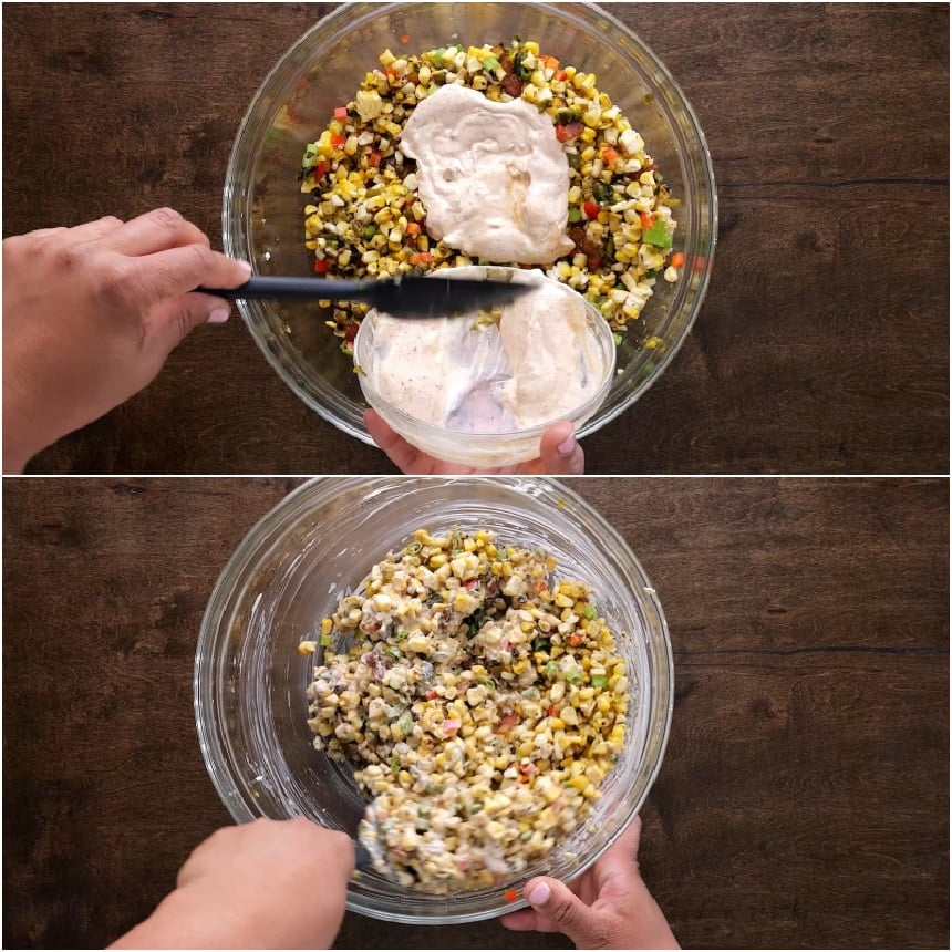 Mixing the dressing in.