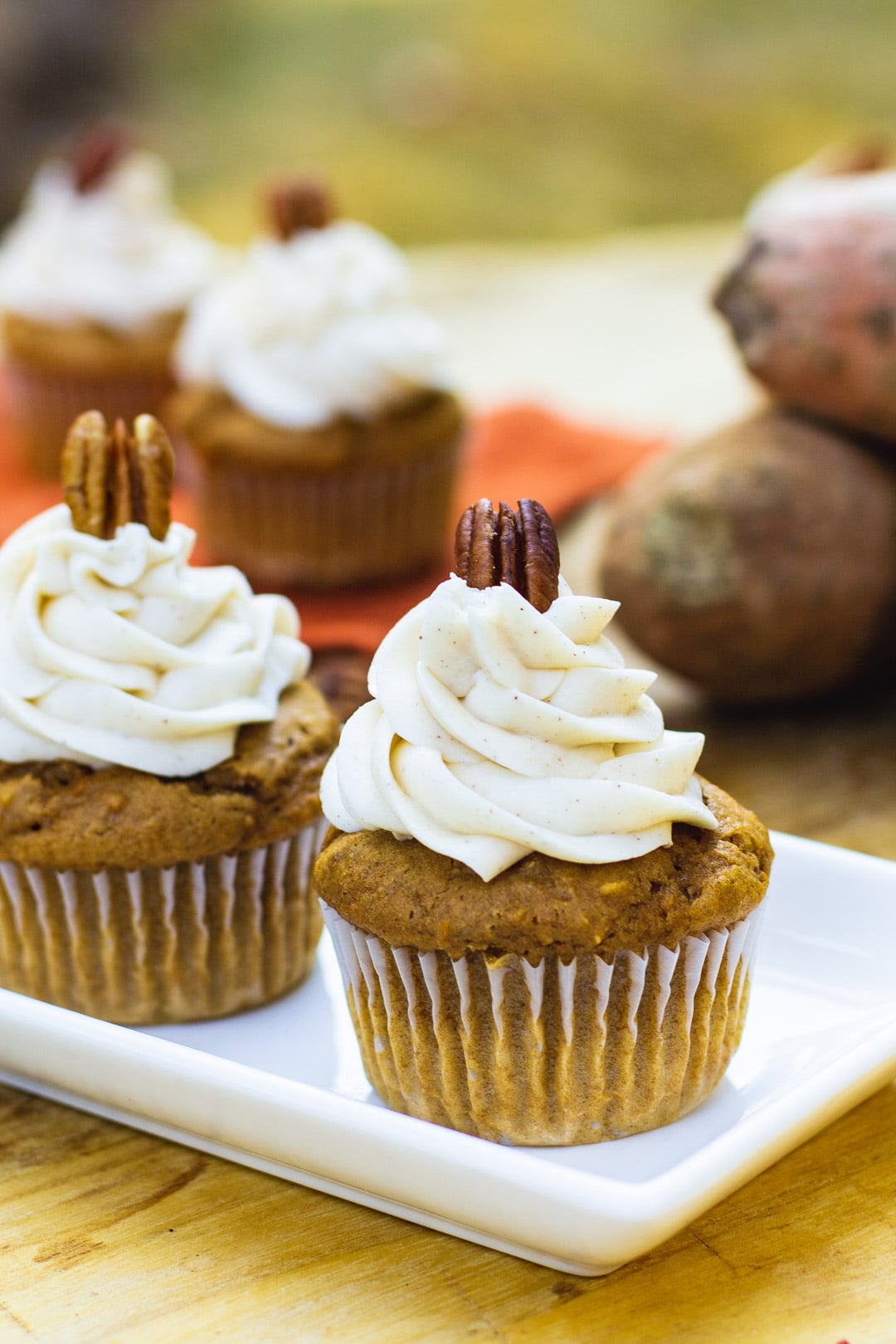 Sweet Potato Cupcakes with Spiced Buttercream on a white serving tray.