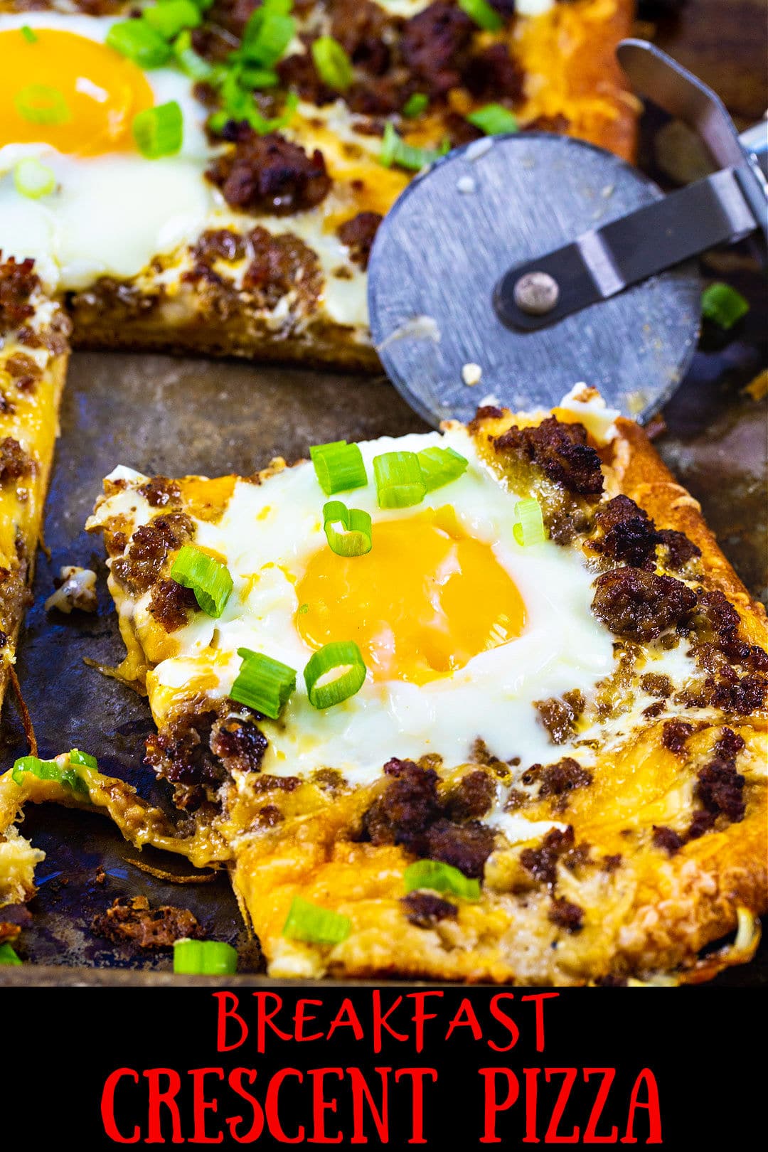 Breakfast Pizza with a slice cut.