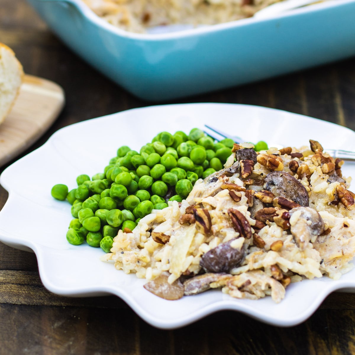 Chicken, Rice, and Mushroom Casserole on a plate with peas.