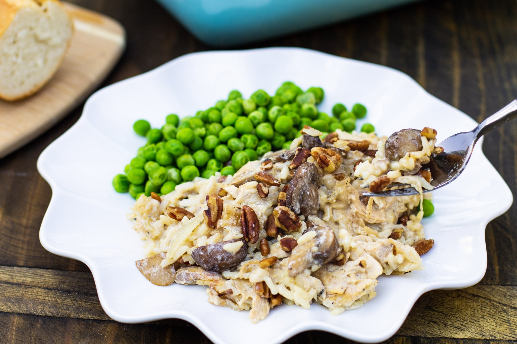 Fork lifting a bite of Chicken, Rice, and Mushroom Casserole.