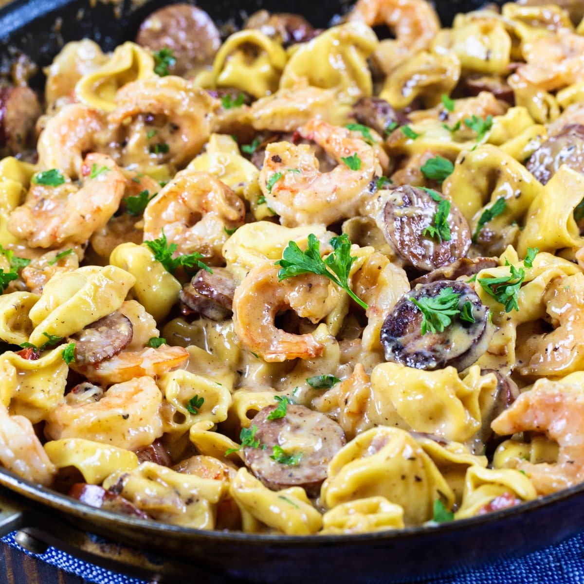 Creamy Tortellini with Shrimp and Smoked Sausage in a large skillet.