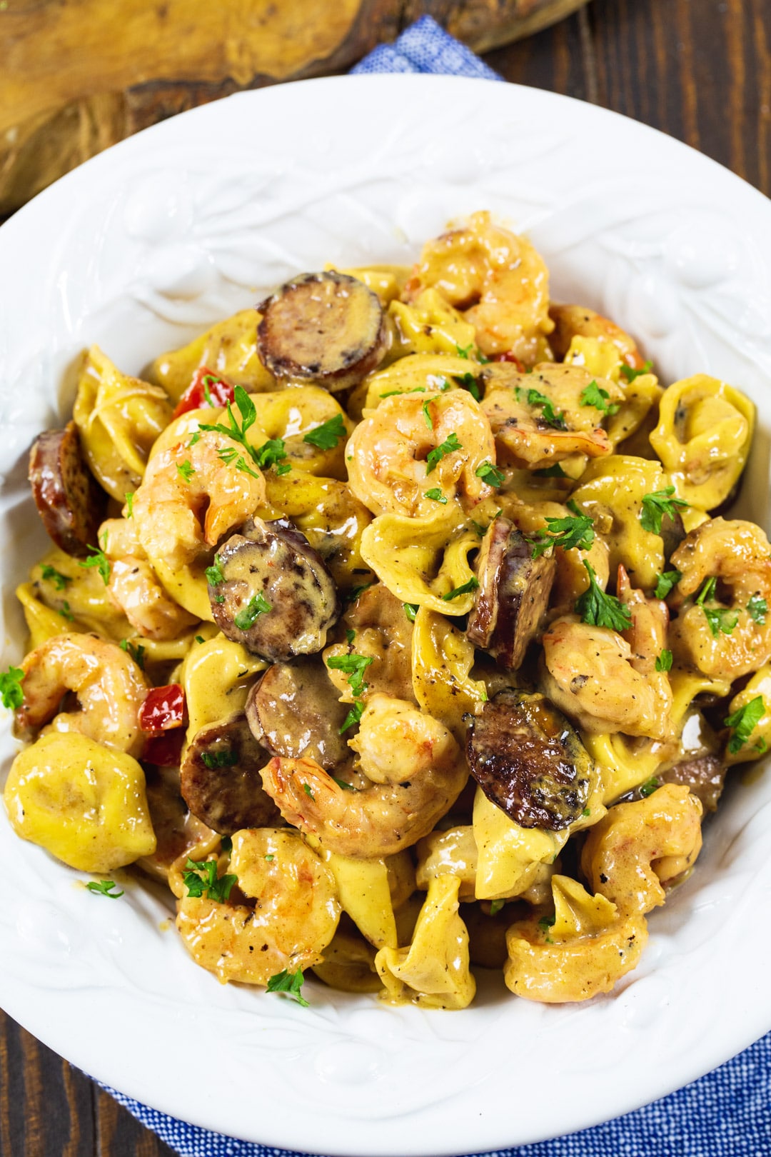 Creamy Tortellini dished up in a pasta bowl.