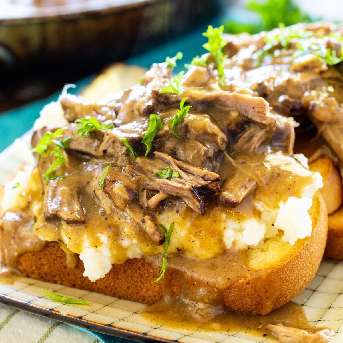 Open-face Hot Beef Sandwiches on a plate.